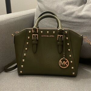 Green Michael Kors crossbody bag with gold detail.